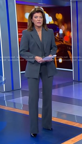 Norah's grey pant suit on CBS Evening News