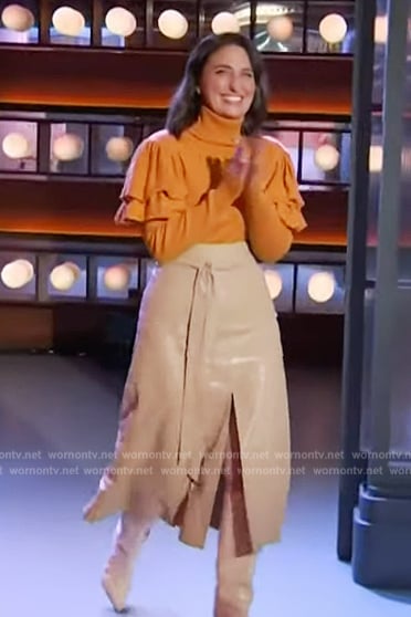 Sara Bareilles's orange ruffle sweater and leather skirt on The Kelly Clarkson Show