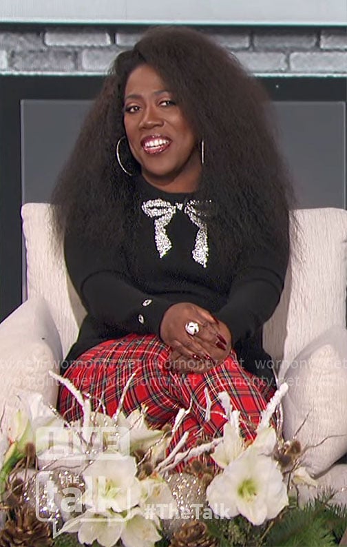 Sheryl's black bow sweater and plaid pants on The Talk