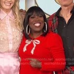 Sheryl’s red embellished bow sweater on The Talk