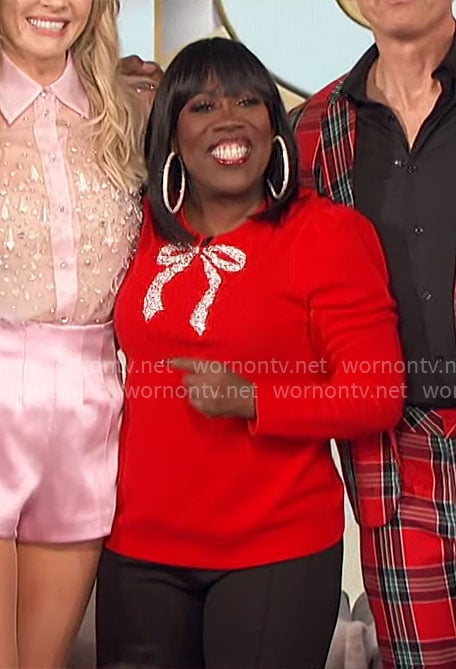 Sheryl's red embellished bow sweater on The Talk