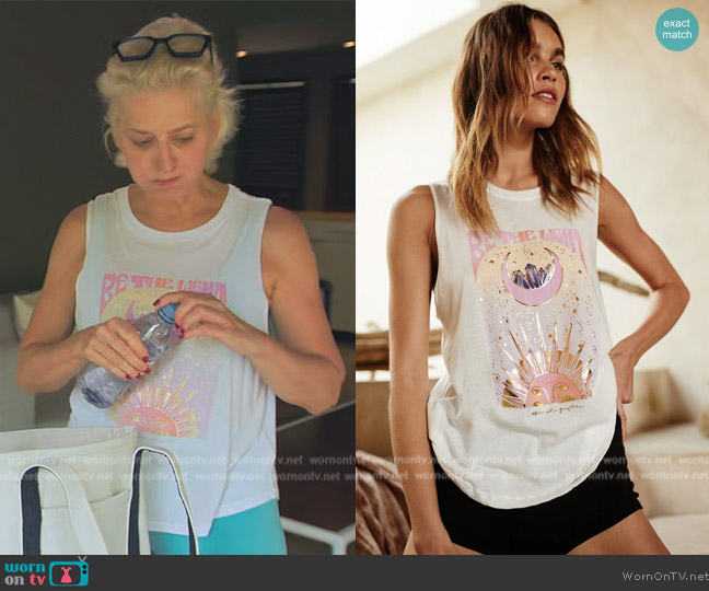 Spiritual Gangster Be the Light Muscle Tank worn by Dorinda Medley on The Real Housewives Ultimate Girls Trip