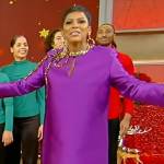 Tamron’s purple bow embellished mini dress on Tamron Hall Show