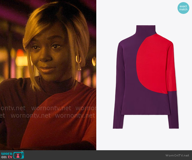 Hazel’s purple and red colorblock top on The Other Black Girl