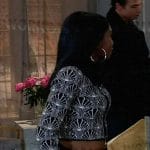 Trina’s black and white patterned zip up cardigan with fur trim on General Hospital