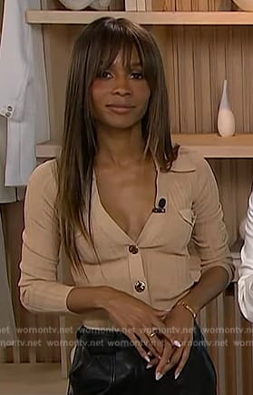 Zuri’s beige cardigan on Access Hollywood