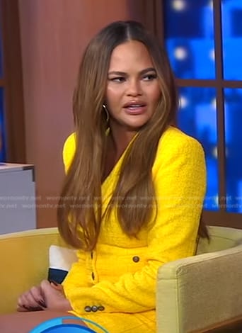 Chrissy Teigen’s yellow cropped blazer and mini skirt on Good Morning America