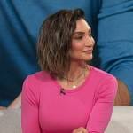 Courtney Lopez’s pink crew neck top on Access Hollywood