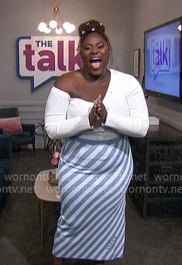 Danielle Brooks’ white off shoulder cardigan and blue diagonal stripe skirt on The Talk