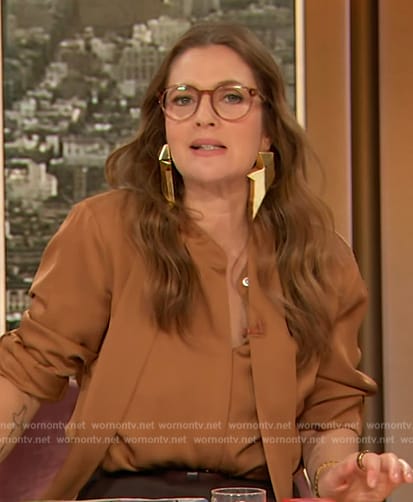 Drew’s brown satin tie neck blouse on The Drew Barrymore Show