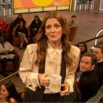 Drew’s white contrast tie neck blouse on The Drew Barrymore Show