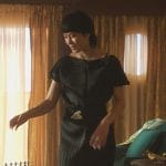 Eleanor’s black pleated dress on Death and Other Details