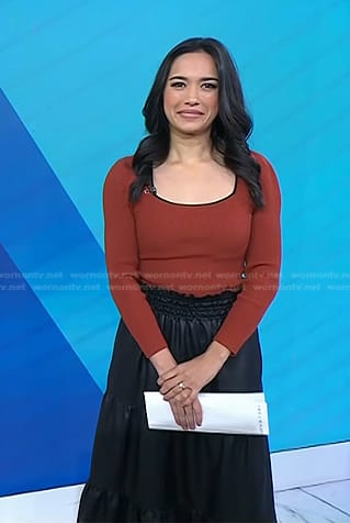 Emilie's orange square neck top and black skirt on Today
