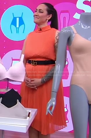 Jene’ Luciani’s orange pleated dress and belt on Good Morning America