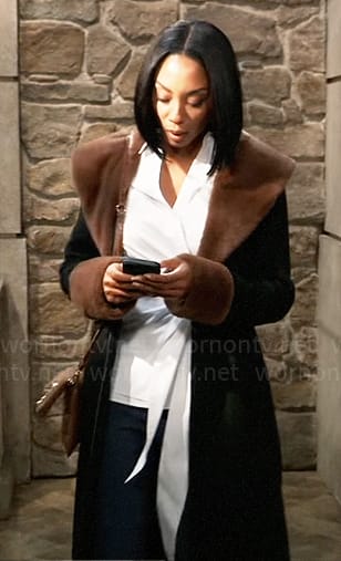 Jordan's black zip up coat with brown fur collar on General Hospital