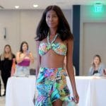 Kiki’s greenfloral print skirt and halter bikini top on The Real Housewives of Miami