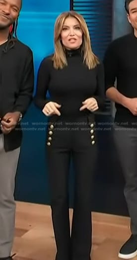 Kit's black pants with gold buttons on Access Hollywood