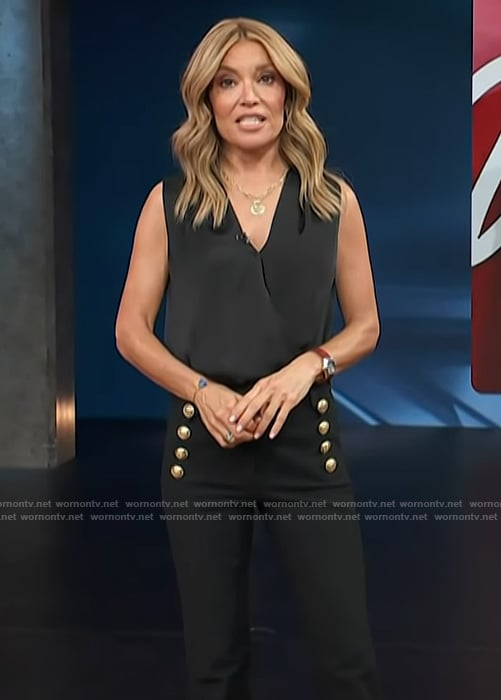 Kit's black pants with gold buttons on Access Hollywood