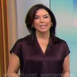 Meg Oliver’s dark purple satin top on CBS Mornings