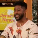 Nate Burleson’s white butterfly print sweater on The Drew Barrymore Show