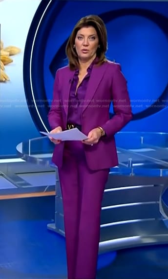 Norah’s purple tie neck blouse and suit on CBS Evening News