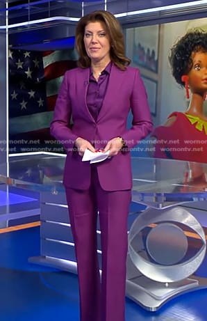 Norah’s purple tie neck blouse and suit on CBS Evening News