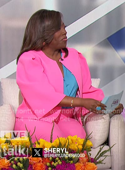 Sheryl's bright pink jacket and pants on The Talk