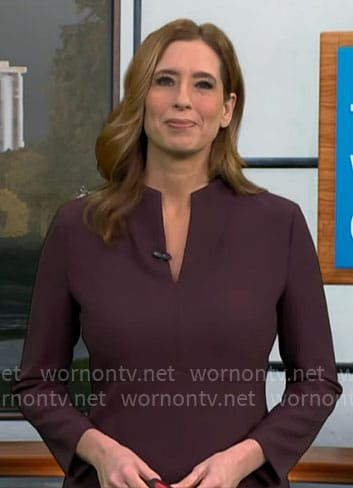 Stephanie Abram’s dark purple split-neck dress on CBS Mornings