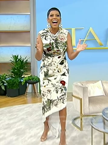 Tamron’s white floral print asymmetric dress on Tamron Hall Show