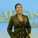 Tamron’s green velvet horsebit suit on Tamron Hall Show