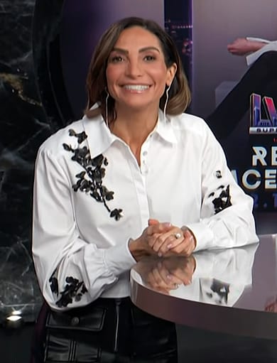 Courtney Lopez’s white floral embellished blouse on E! News