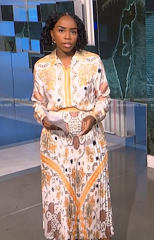 Zinhle’s white print shirt and pleated skirt on NBC News Daily