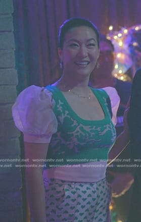 Sumi's green cropped vest and puff sleeve top on Good Trouble