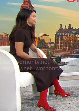 Camila Mendes' brown turtleneck top and midi skirt with red shoes on CBS Mornings