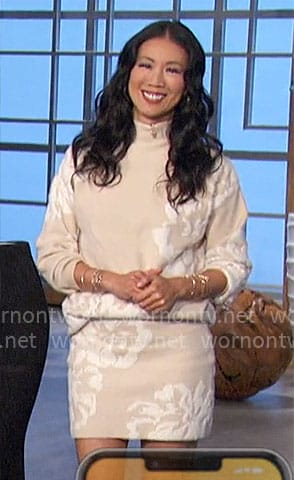 Chi-Lan’s beige and white floral sweater and skirt set on The Talk