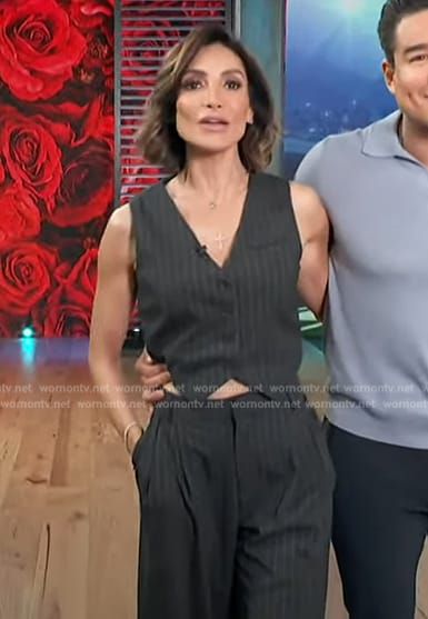 Courtney’s black pinstripe vest and pants on Access Hollywood