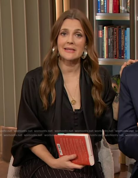 Drew’s black tie neck blouse and skirt on The Drew Barrymore Show