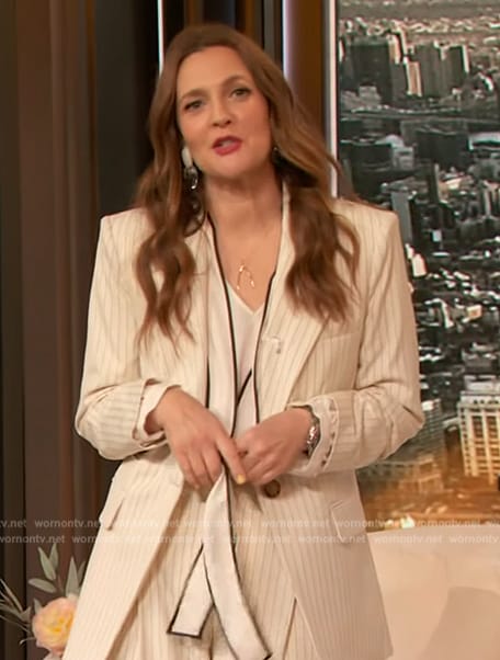 Drew’s white tie neck blouse and pinstripe blazer on The Drew Barrymore Show