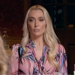 Erika Jayne’s pink floral print tie neck blouse on Access Hollywood