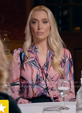 Erika Jayne's pink floral print tie neck blouse on Access Hollywood