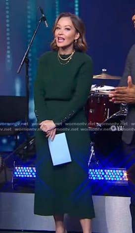 Eva’s green button sleeve sweater and skirt on Good Morning America