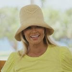 Gizelle’s yellow tee and bucket hat on The Real Housewives of Potomac