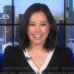 Jo Ling Kent’s black cardigan with white trim on CBS Mornings