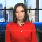 Jo Ling Kent’s red cardigan with gold buttons on CBS Evening News