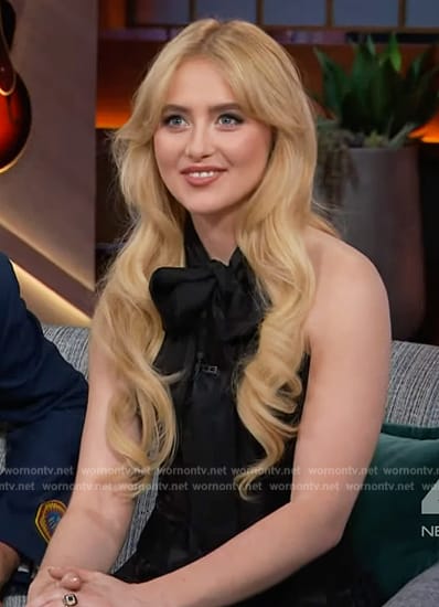 Kathryn Newton's black floral print tie neck dress on The Kelly Clarkson Show