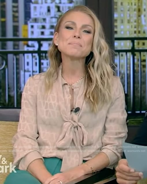 Kelly’s beige printed tie neck blouse on Live with Kelly and Mark