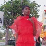 Kiki’s red ruffle mini dress on The Real Housewives of Miami