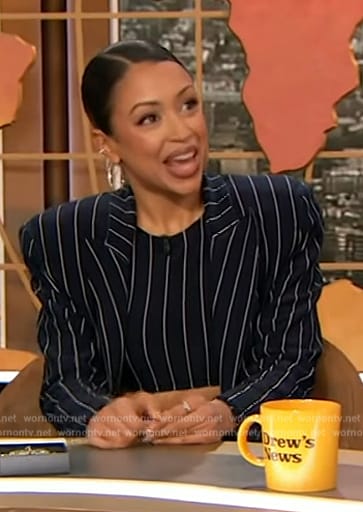 Liza Koshy's navy pinstripe top and coat on The Drew Barrymore Show