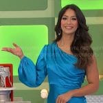 Manuela’s blue satin one-shoulder dress on The Price is Right