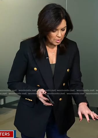 Meg Oliver's navy blazer with gold buttons on CBS Evening News